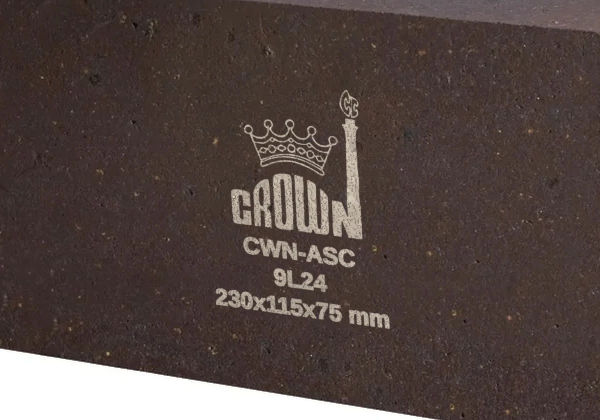 Close-up of the off-white Crown stencil on a CWN-ASC alumina-SiC brick
