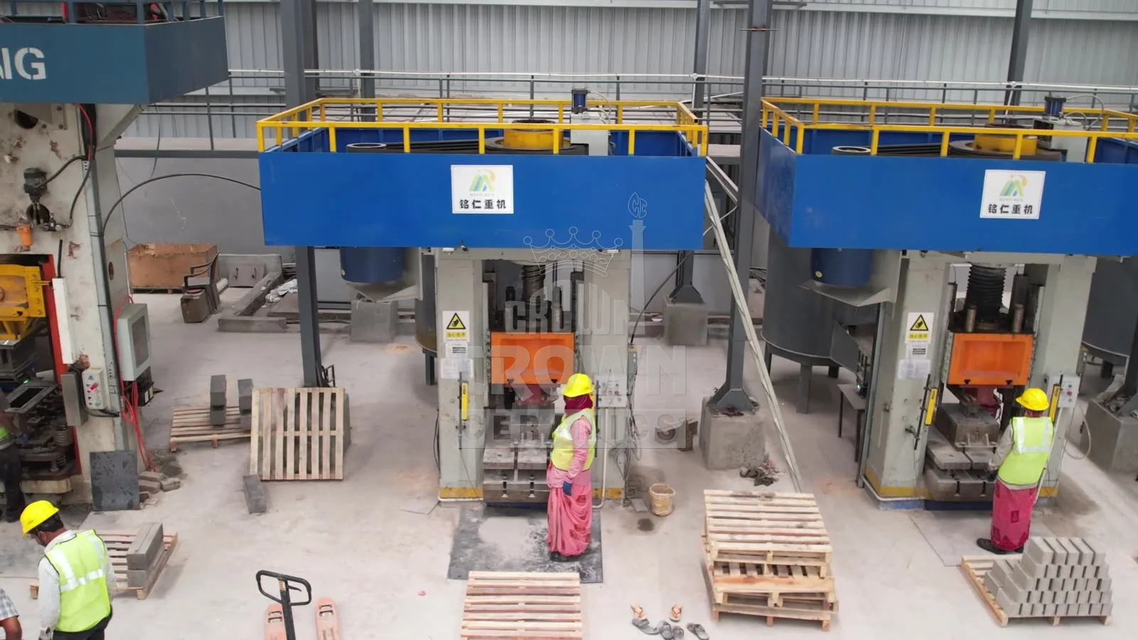 Operators at the hydraulic brick presses