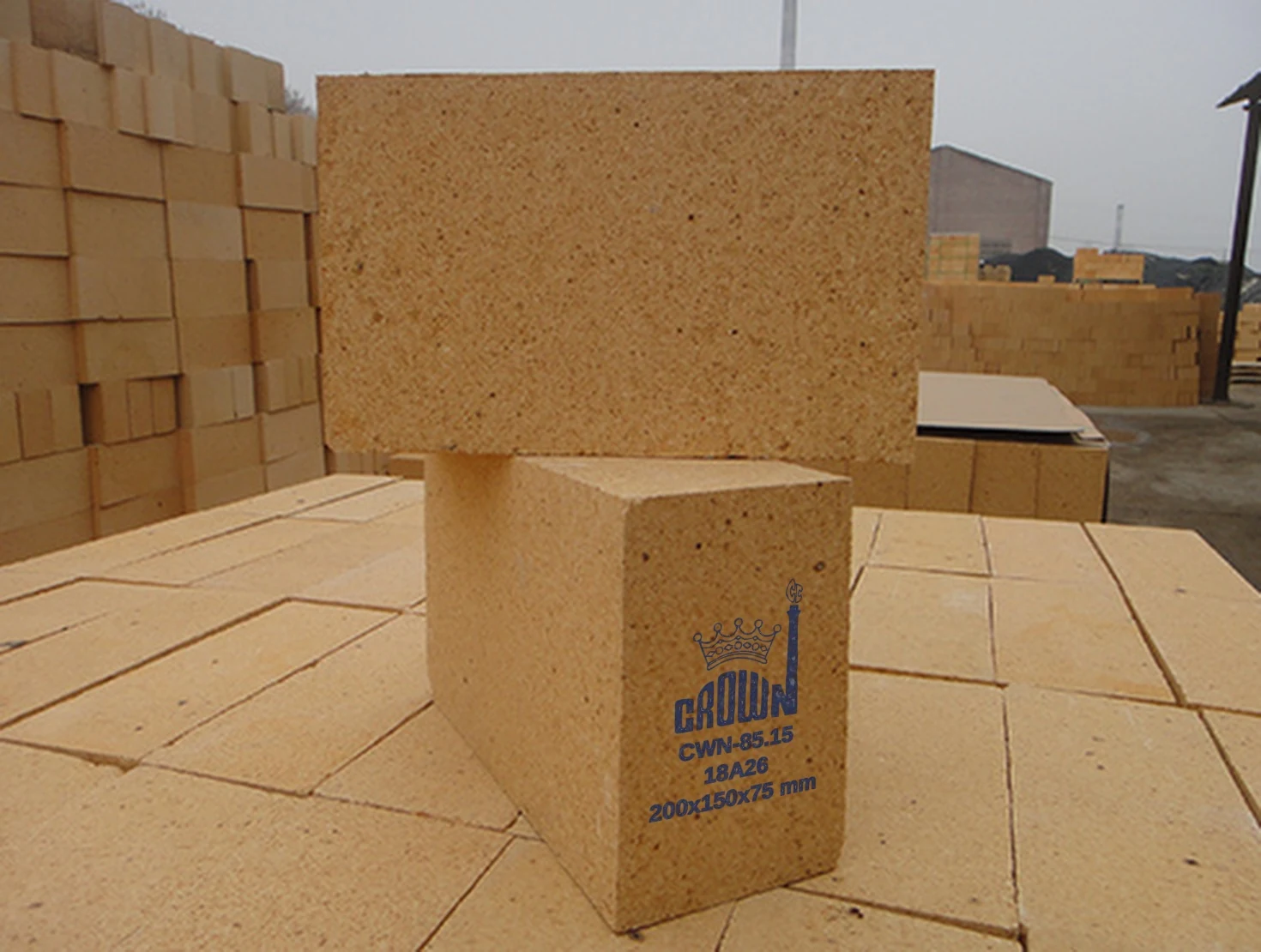 Crown CWN-85.15 high alumina brick, stencilled with the Crown mark, grade, batch code and size
